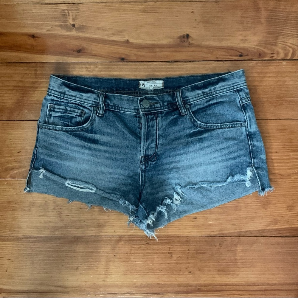 Free People distressed medium wash denim shorts